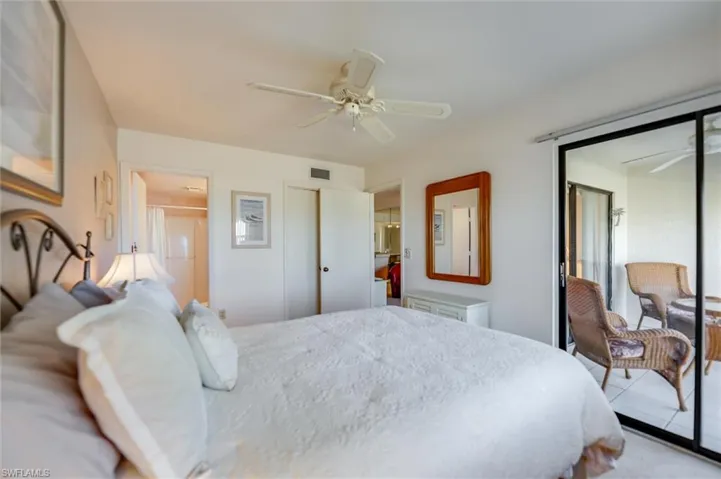 Bedroom with ceiling fan and a closet