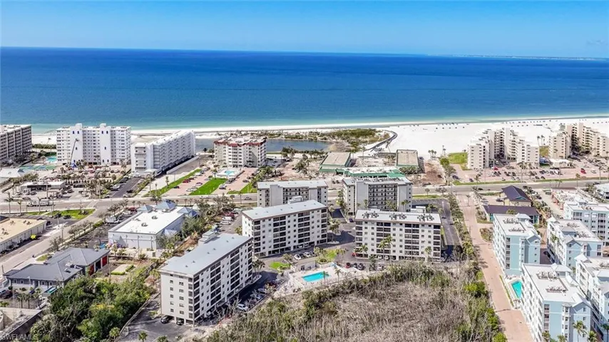 Bird's eye view featuring a view of the beach and a water view