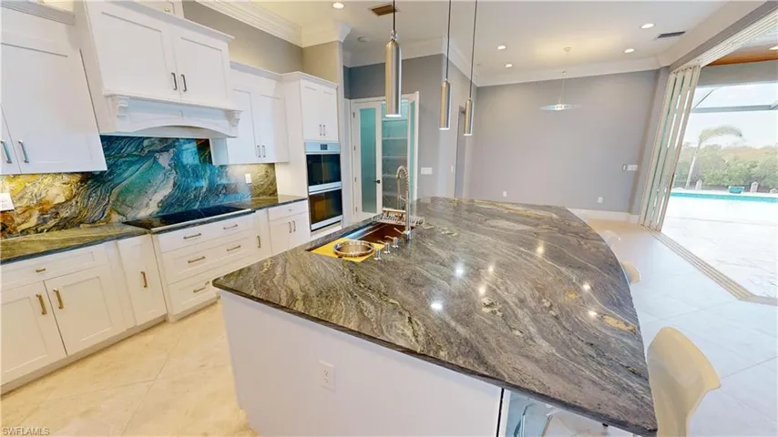 Large Island with working kitchen sink.