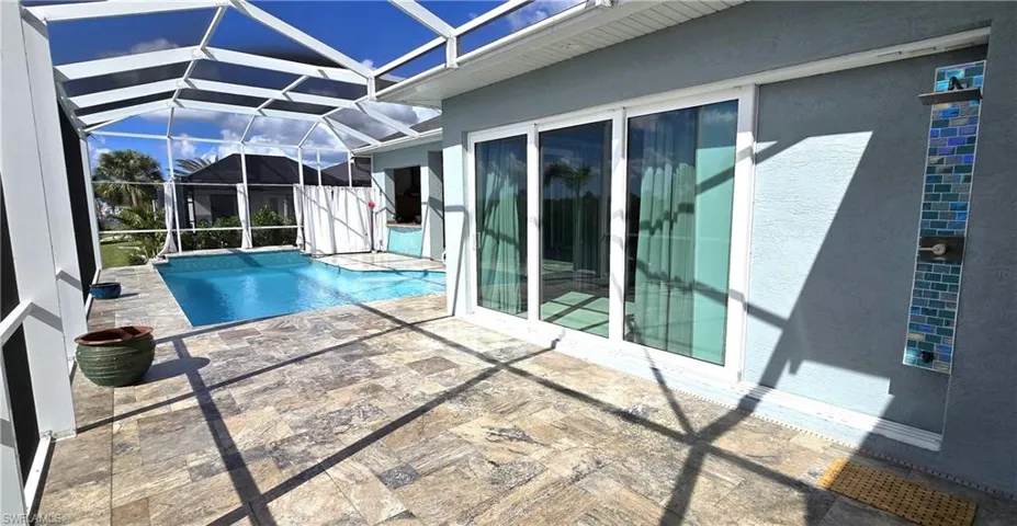 Slider from Primary Bedroom with outdoor shower.