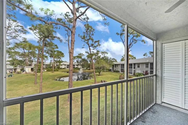 Unfurnished sunroom featuring a water view