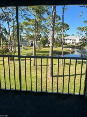 View of yard with a water view