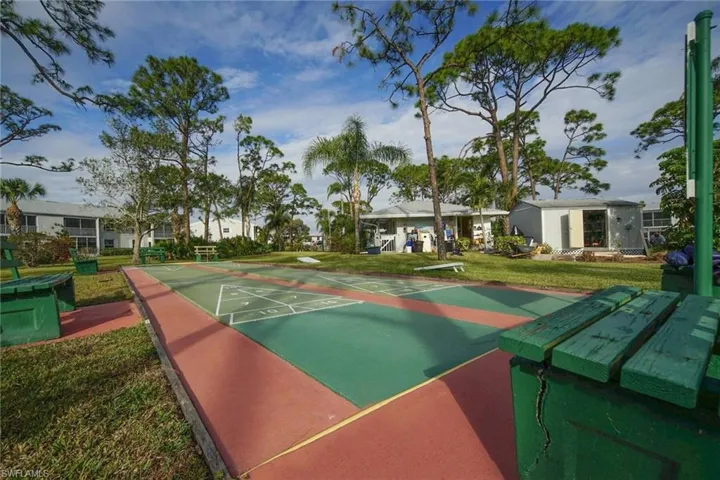 View of home's community with a lawn