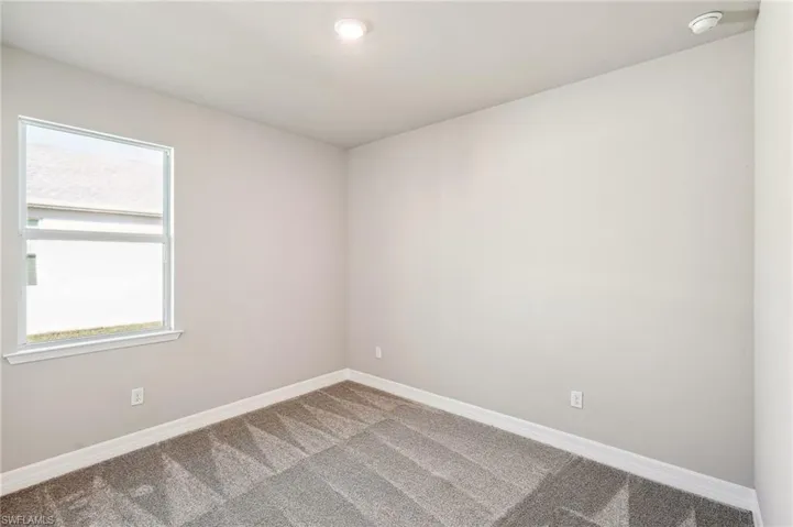 Spare room with carpet floors