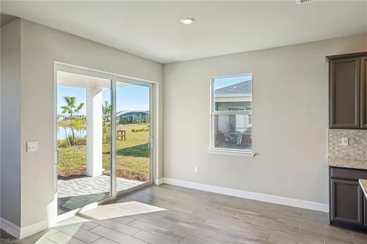 Doorway with light hardwood / wood-style floors