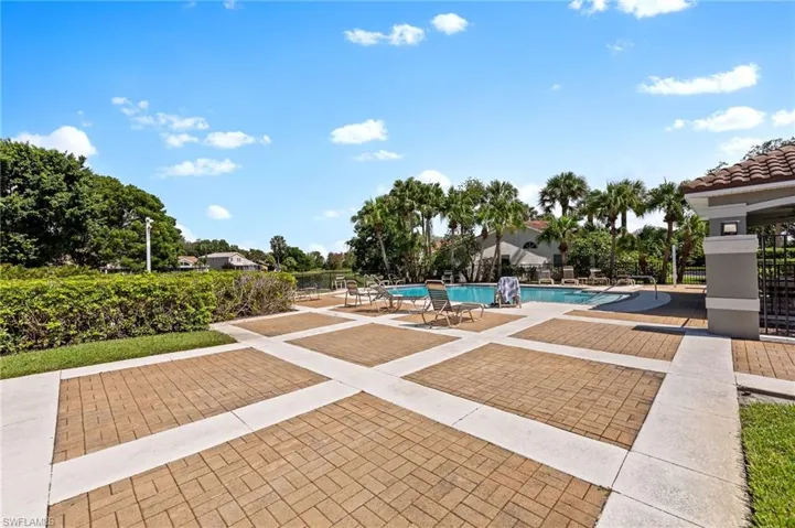 Community pool with a patio