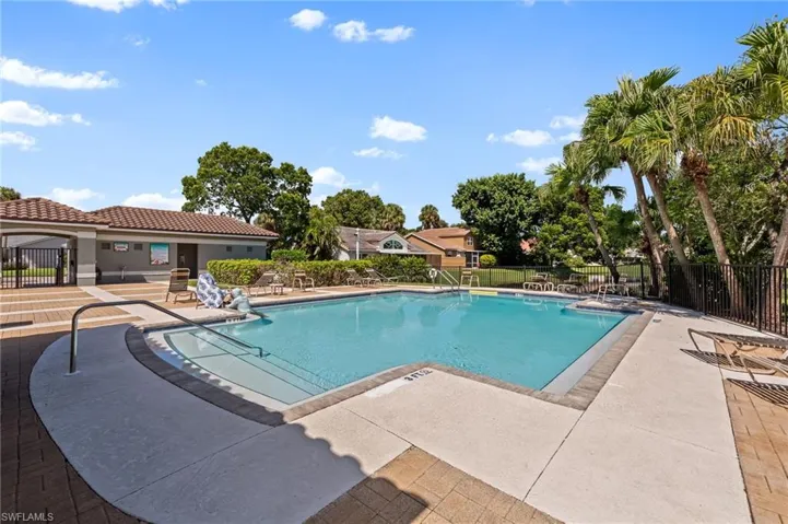 Community pool featuring a patio