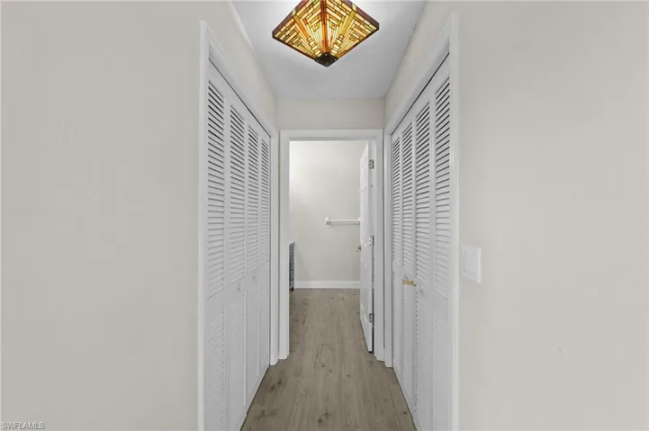 Corridor with wood finished floors