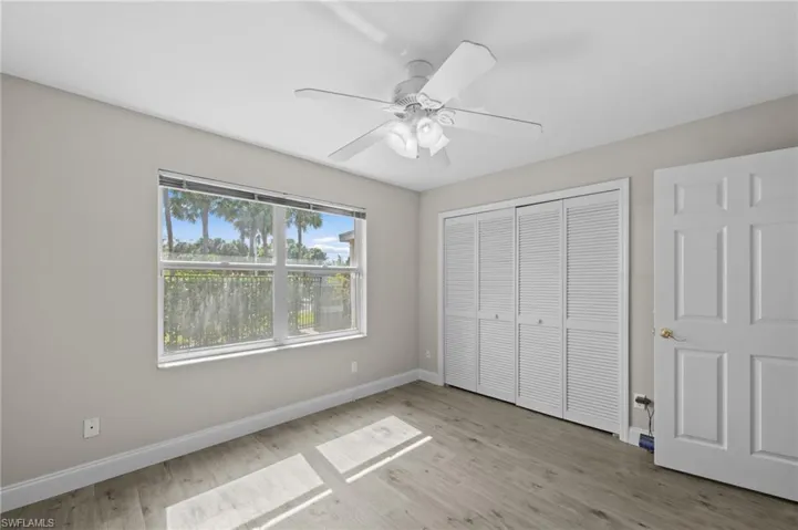 Unfurnished bedroom featuring ceiling fan, light wood finished floors, and a closet
