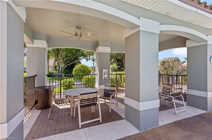 View of patio with ceiling fan and outdoor dining space