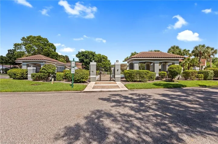Mediterranean / spanish house featuring a gate, stucco siding, a tile roof, and a gazebo