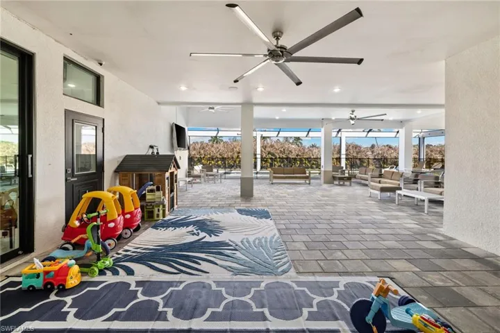 View of patio featuring an outdoor hangout area and ceiling fan