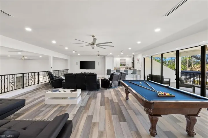 Rec room with a ceiling fan, billiards, light wood-style flooring, and recessed lighting