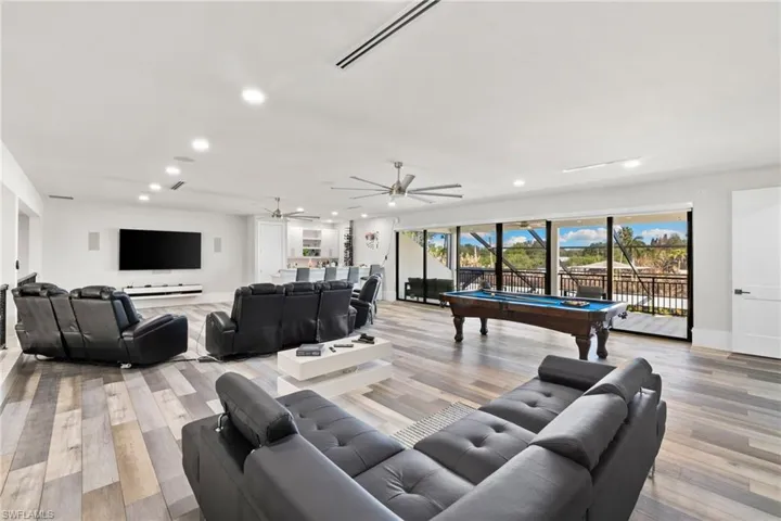 Living area featuring billiards, light wood finished floors, recessed lighting, and ceiling fan