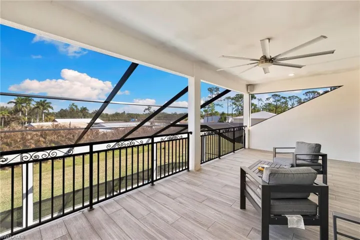 Wooden terrace featuring ceiling fan