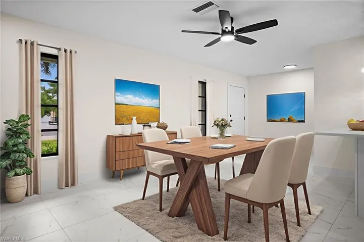 Dining area with light marble finish floors and a ceiling fan