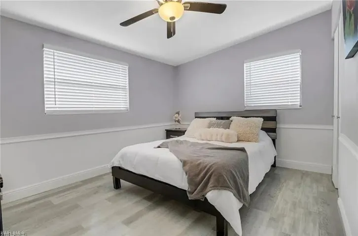 Bedroom featuring light wood-style floors and a ceiling fan