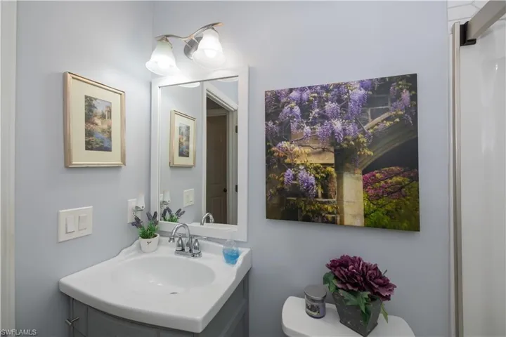 Half bathroom featuring toilet and vanity