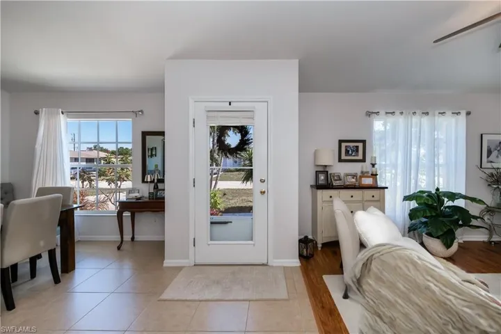 Entrance foyer featuring light tile patterned floors and baseboards