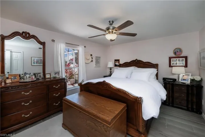 Bedroom with access to outside and ceiling fan