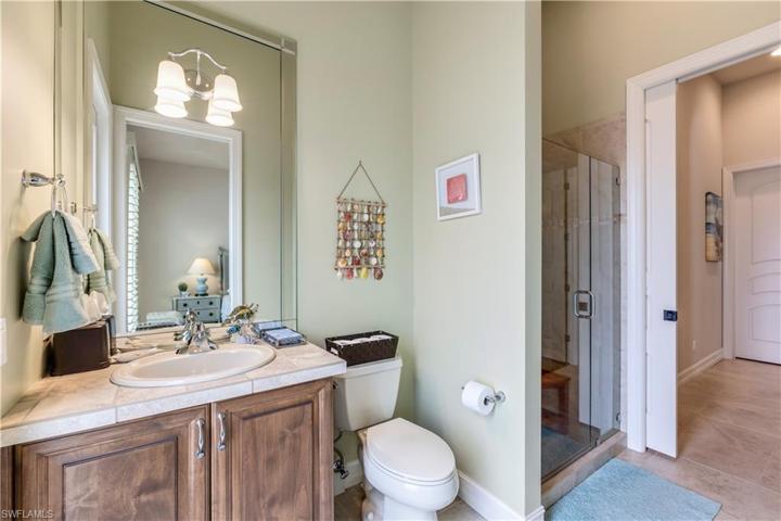 First floor bathroom with door to pool