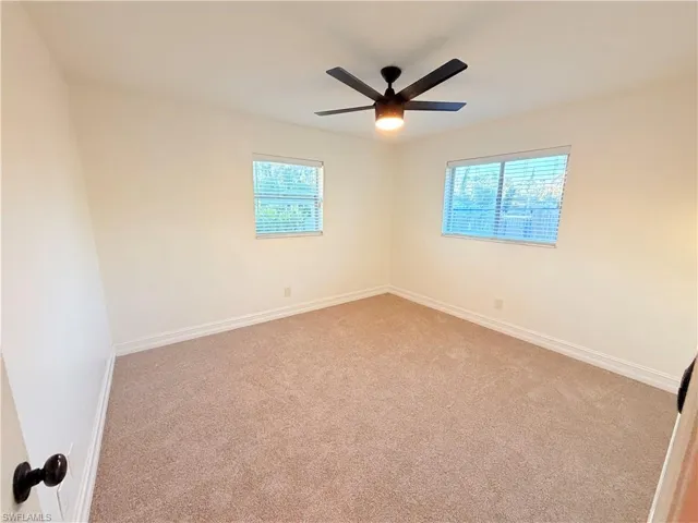 Carpeted spare room with plenty of natural light