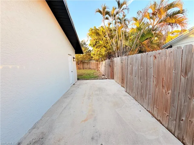 Fenced backyard featuring a patio