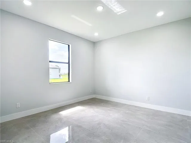 Unfurnished room with tile flooring