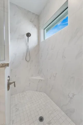 Bathroom with a tile shower