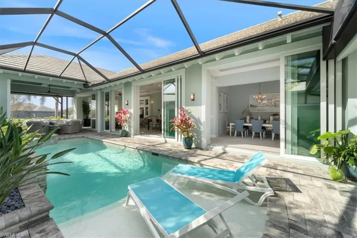 Pool featuring a patio and outdoor lounge area