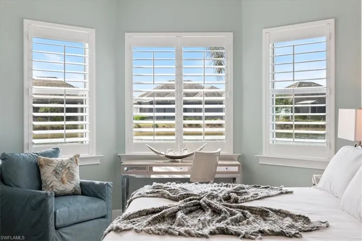 Bedroom with multiple windows