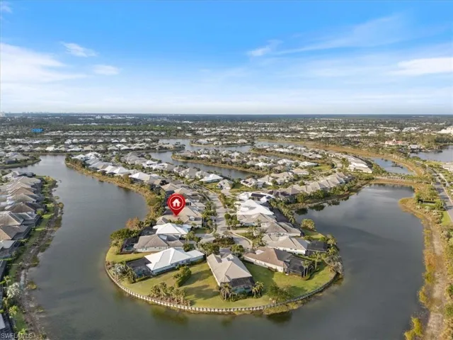 Aerial view featuring a water view and a residential view