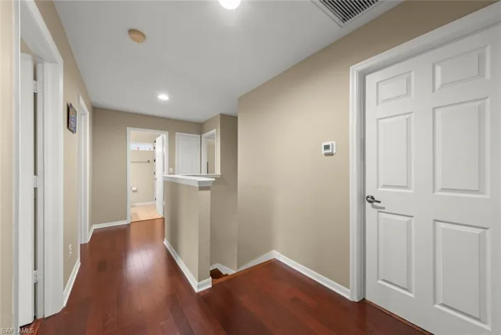 Upstairs hall featuring an upstairs landing and recessed lighting