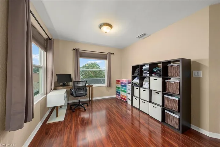 Space in primary bedroom that can be used as a sitting room, home office, or exercise space
