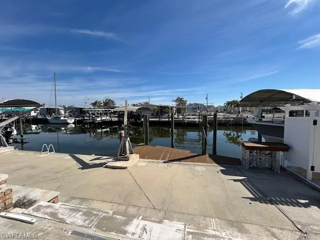 Dock area featuring a water view