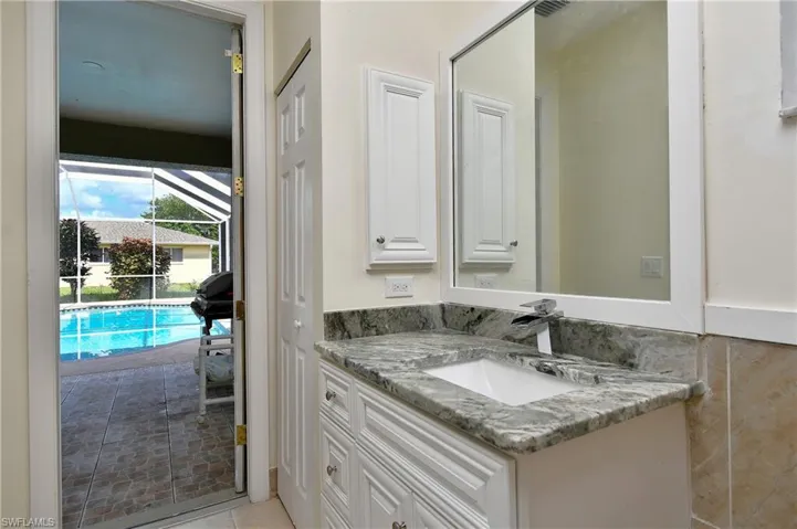 Bathroom featuring vanity and tile patterned floors