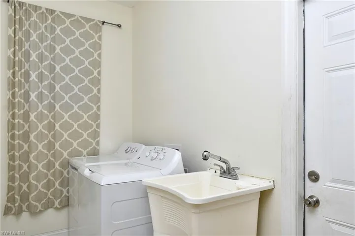Laundry area featuring washing machine and clothes dryer