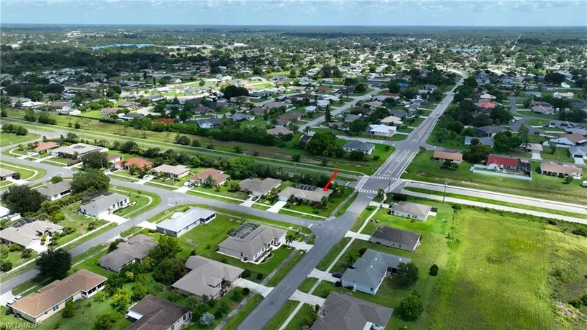 Aerial view of property's location featuring nearby suburban area