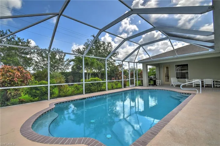 Outdoor pool featuring a patio and a lanai