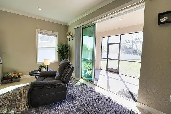 Corridor featuring crown molding, light tile patterned floors, and recessed lighting
