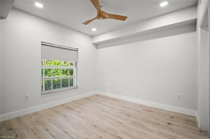 Spare room featuring light wood finished floors, recessed lighting, and ceiling fan