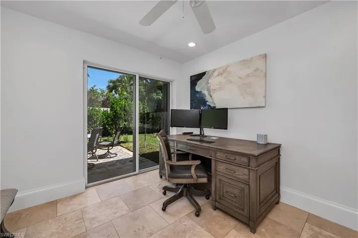 Office area featuring recessed lighting and a ceiling fan