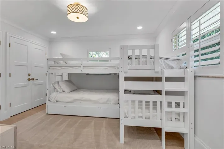Bedroom featuring crown molding and recessed lighting