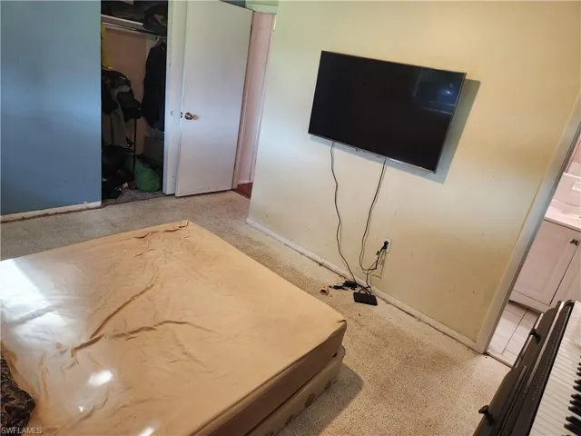 Bedroom with carpet floors and a closet