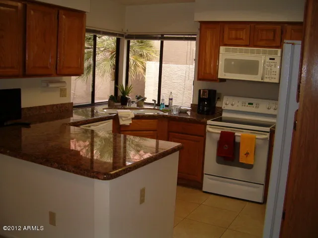 KITCHEN WITH PASSTHRU TO OUTSIDE BAR