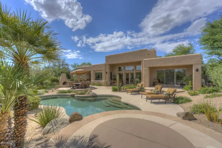 Back view of home. Multiple seating areas