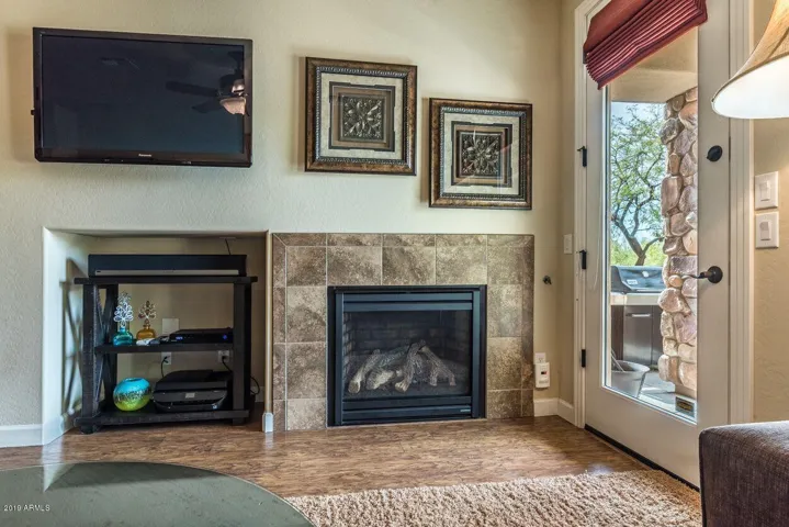 TV and Gas Fireplace in livingroom, bbq on patio