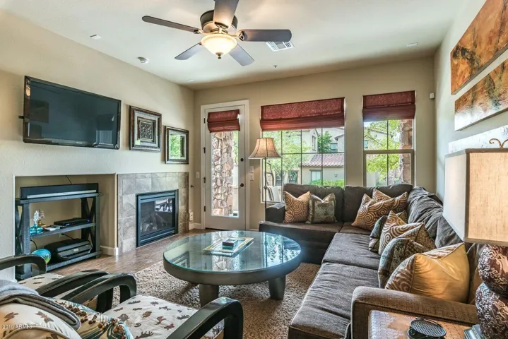 Living room with fireplace and tv