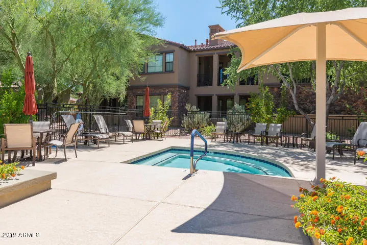 Tables with umbrellas and spa