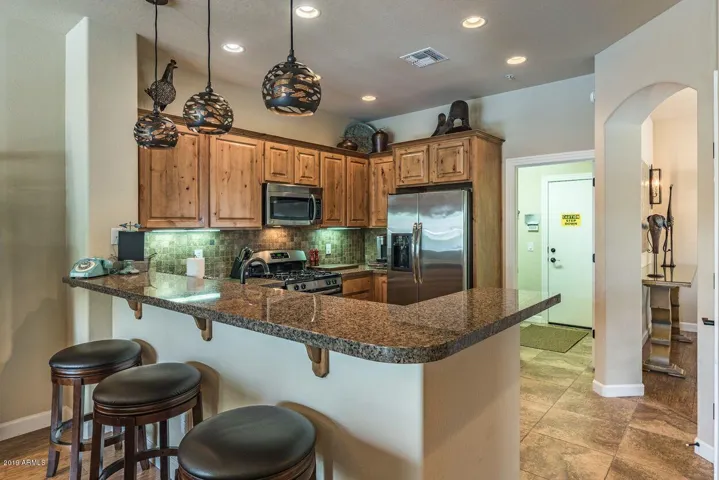 Fully stocked Kitchen with breakfast bar